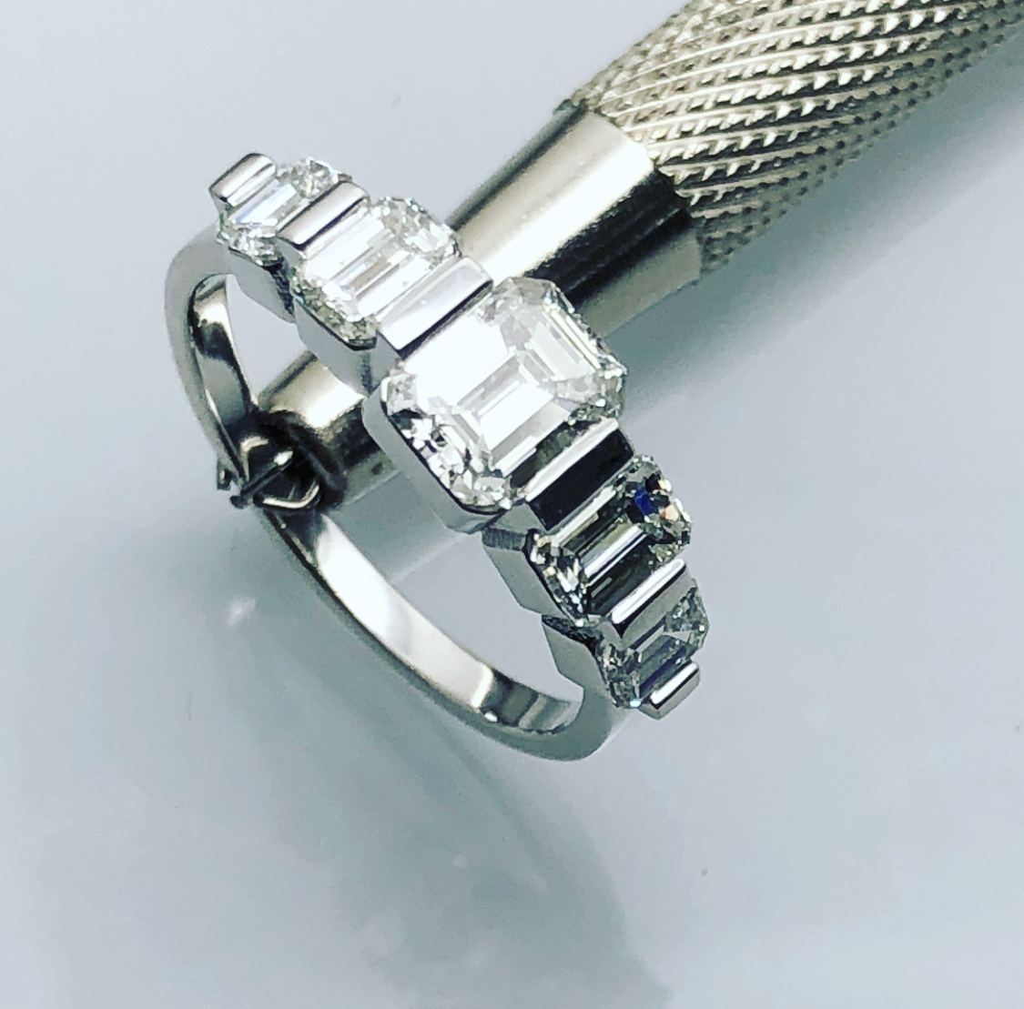 Emerald cut 5 diamond platinum wedding ring